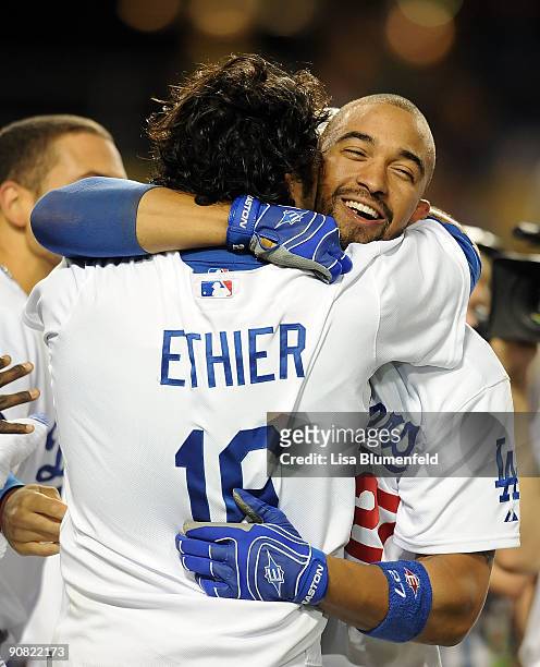 Andre Ethier and teammate Matt Kemp of the Los Angeles Dodgers celebrate after defeating the Pittsburgh Pirates 5-4 in 13 innings at Dodger Stadium...