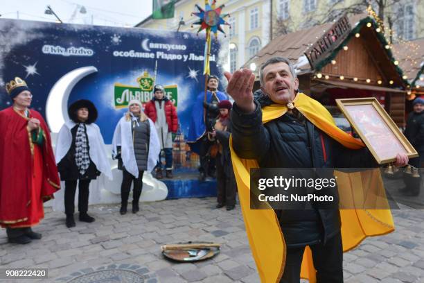 People dressed in traditional costumes celebrate the Malanka festival in Lviv Rynok Square. Malanka is a Ukrainian folk holiday celebrated on January...