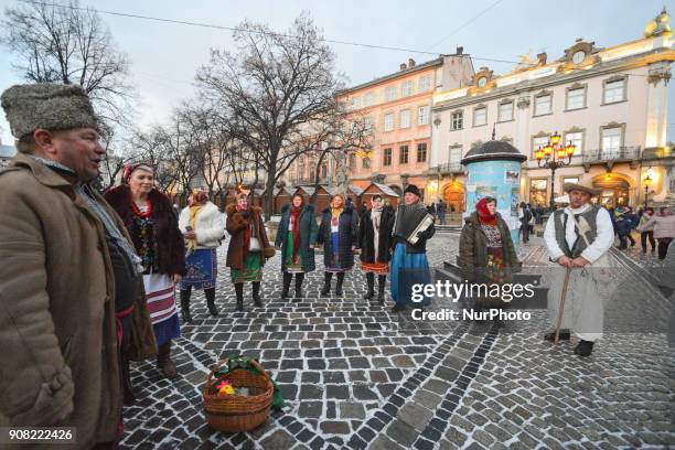 People dressed in traditional costumes celebrate the Malanka festival in Lviv Rynok Square. Malanka is a Ukrainian folk holiday celebrated on January...