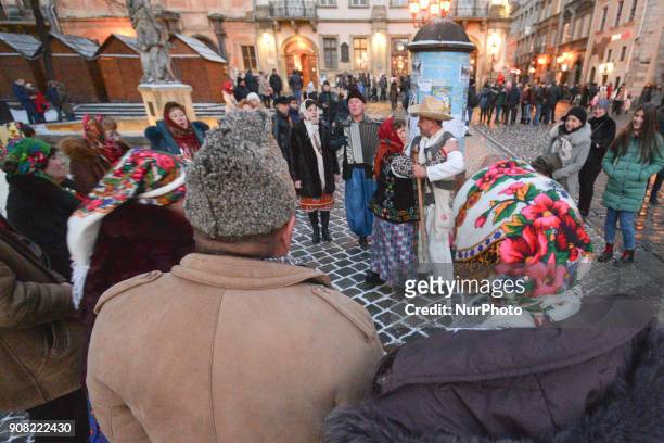 People dressed in traditional costumes celebrate the Malanka festival in Lviv Rynok Square. Malanka is a Ukrainian folk holiday celebrated on January...