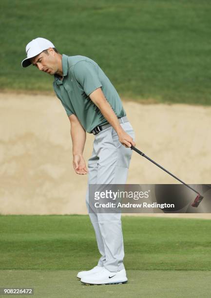 Ross Fisher of England reacts to a missed puutt for birdie on the 11th green during the final round of the Abu Dhabi HSBC Golf Championship at Abu...