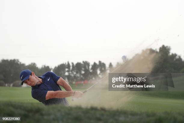 Rory McIlroy of Northern Ireland plays his second shot from a bunker on the 13th hole during the final round of the Abu Dhabi HSBC Golf Championship...