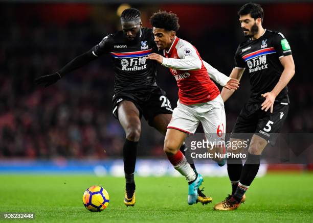 Arsenal's Reiss Nelson battles for possession with Crystal Palace's Bakary Sako and Crystal Palace's James Tomkins during Premier League match...