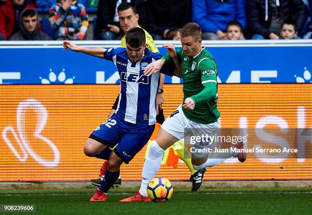 Raul Garcia of Club Deportivo Leganes duels for the ball with Martin Aguirregabiria of Deportivo Alaves during the La Liga match between Deportivo...