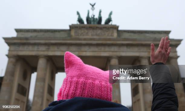 An activist with a "pink pussy hat" participates in front of the Brandenburg Gate in a demonstration for women's rights on January 21, 2018 in...