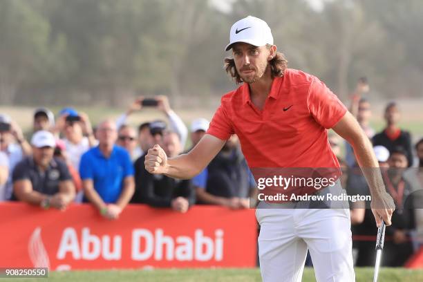 Tommy Fleetwood of England celebrates after putting for birdie to finish 22 under on the 18th green during the final round of the Abu Dhabi HSBC Golf...