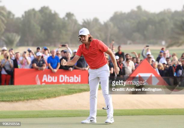 Tommy Fleetwood of England celebrates after putting for birdie to finish 22 under on the 18th green during the final round of the Abu Dhabi HSBC Golf...