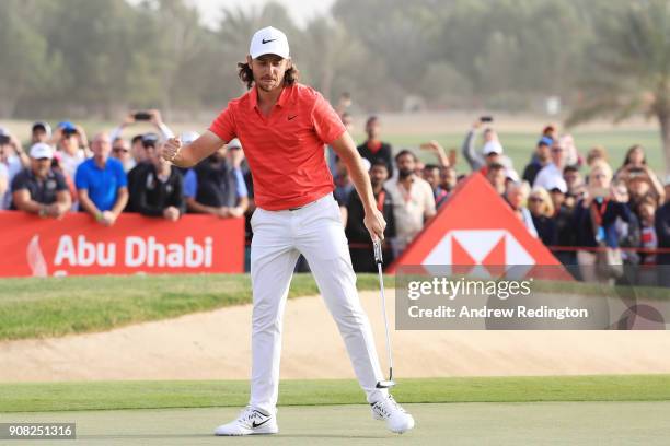 Tommy Fleetwood of England celebrates after putting for birdie on the 18th green to finish 22 under during the final round of the Abu Dhabi HSBC Golf...