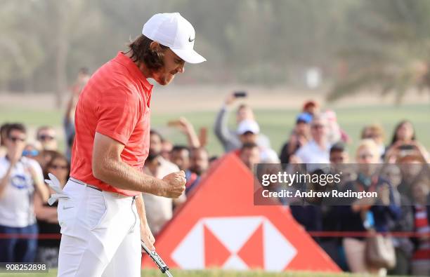 Tommy Fleetwood of England celebrates after putting for birdie on the 18th green to finish 22 under during the final round of the Abu Dhabi HSBC Golf...