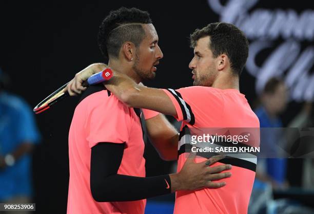 Bulgaria's Grigor Dimitrov speaks with Australia's Nick Kyrgios after winning their men's singles fourth round match on day seven of the Australian...