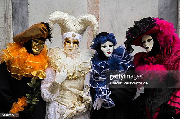 group of four masks at carnival in venice (xxl) - venice carnival stock pictures, royalty-free photos & images