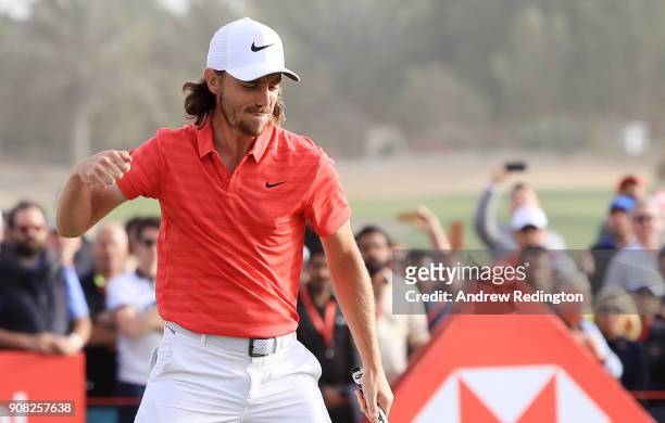 Tommy Fleetwood of England celebrates after putting for birdie on the 18th green to finish 22 under during the final round of the Abu Dhabi HSBC Golf...