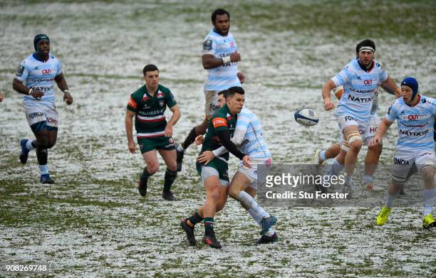 Leicester Tigers centre Matt Toomua offloads in the tackle during the European Rugby Champions Cup match between Leicester Tigers and Racing 92 at...