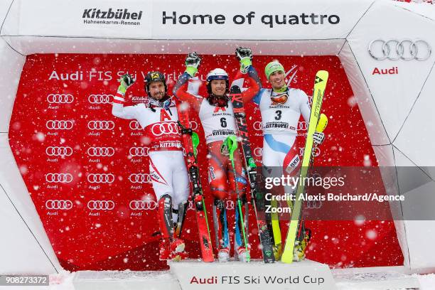 Marcel Hirscher of Austria takes 2nd place, Henrik Kristoffersen of Norway takes 1st place, Daniel Yule of Switzerland takes 3rd place during the...