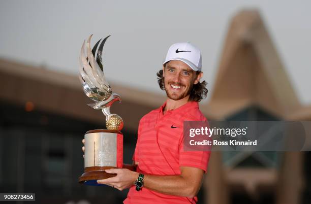 Tommy Fleetwood of England celebrates with the winner's trophy after the final round of the Abu Dhabi HSBC Golf Championship at Abu Dhabi Golf Club...