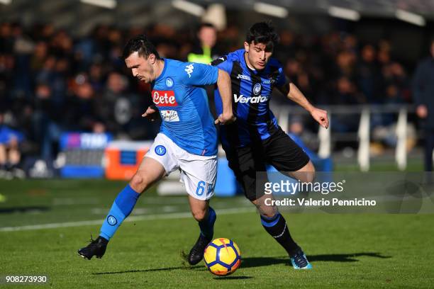 Riccardo Orsolini of Atalanta BC is challenghed by Mario Rui of SSC Napoli during the serie A match between Atalanta BC and SSC Napoli at Stadio...