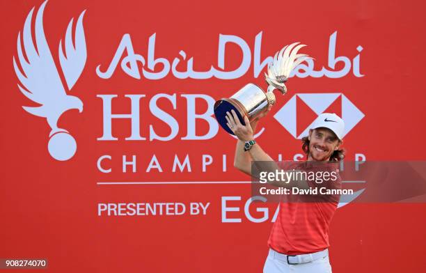 Tommy Fleetwood of England holds the Falcon Trophy after his win in the final round of the Abu Dhabi HSBC Golf Championship at Abu Dhabi Golf Club on...