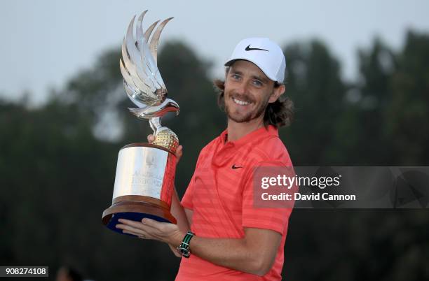 Tommy Fleetwood of England holds the Falcon Trophy after his win in the final round of the Abu Dhabi HSBC Golf Championship at Abu Dhabi Golf Club on...