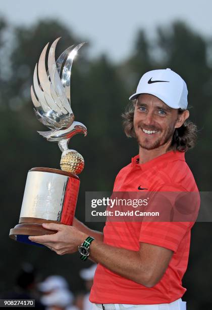 Tommy Fleetwood of England holds the Falcon Trophy after his win in the final round of the Abu Dhabi HSBC Golf Championship at Abu Dhabi Golf Club on...