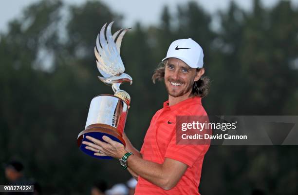 Tommy Fleetwood of England holds the Falcon Trophy after his win in the final round of the Abu Dhabi HSBC Golf Championship at Abu Dhabi Golf Club on...