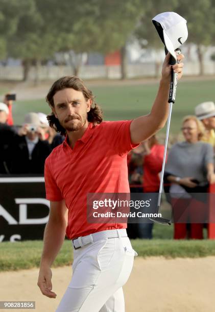 Tommy Fleetwood of England waves to the crowds on the 18th green after his two shot win during the final round of the Abu Dhabi HSBC Golf...