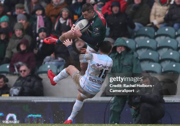 Leicester Tigers' Jonny May is tackled in the air by Racing 92's Brice Dulin during the European Rugby Champions Cup match between Leicester Tigers...