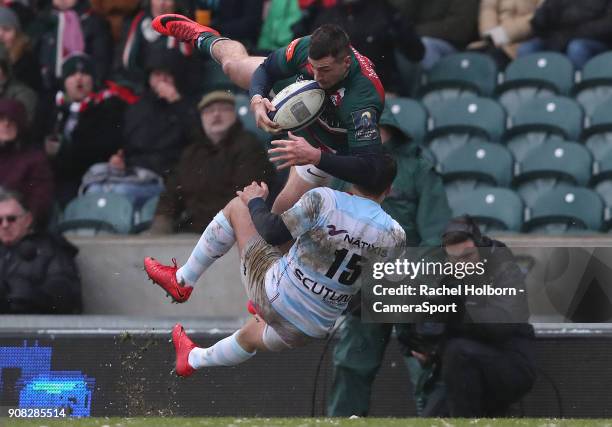 Leicester Tigers' Jonny May is tackled in the air by Racing 92's Brice Dulin during the European Rugby Champions Cup match between Leicester Tigers...