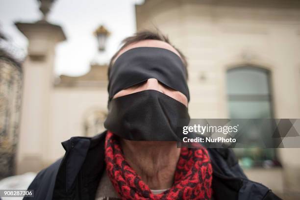 Masked man during Stolen Justice protest in Warsaw on January 21, 2018