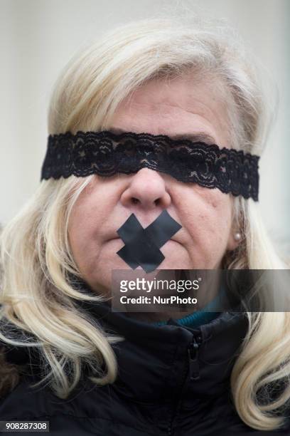 Masked woman during Stolen Justice protest in Warsaw on January 21, 2018