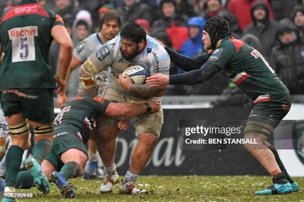 Racing 92's New Zealand prop Ben Tameifuna is tackled during the European Champions Cup Pool 4 rugby union match between Leicester Tigers and Racing...