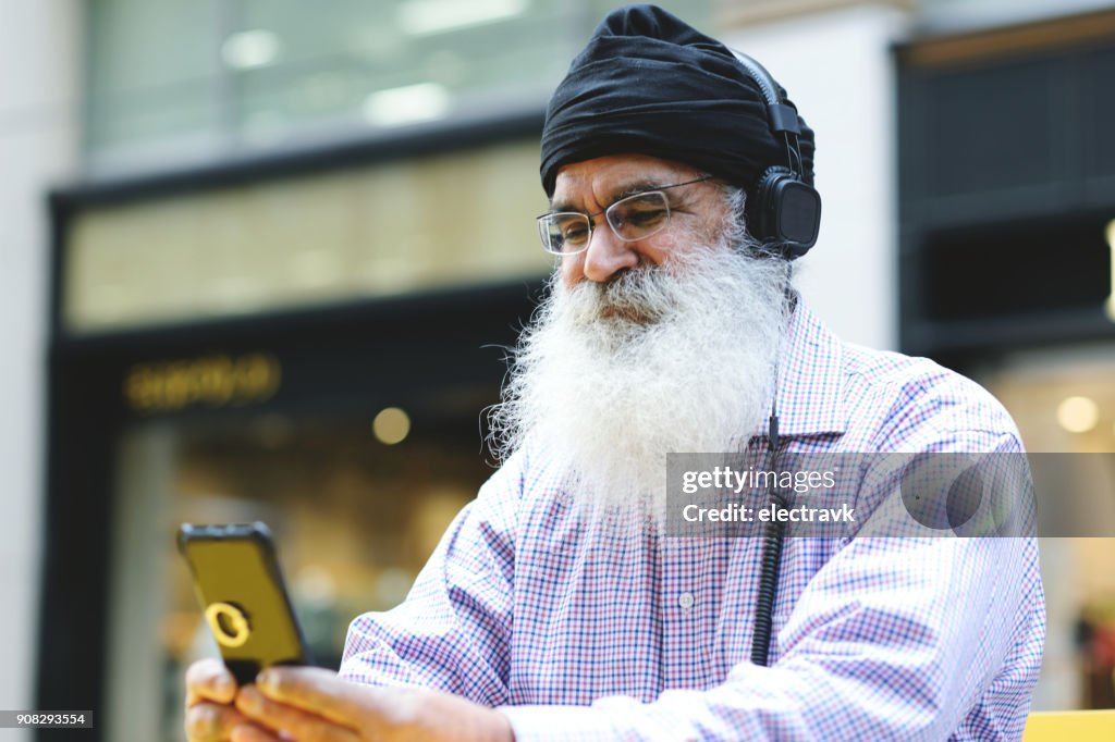 Older man listening to music