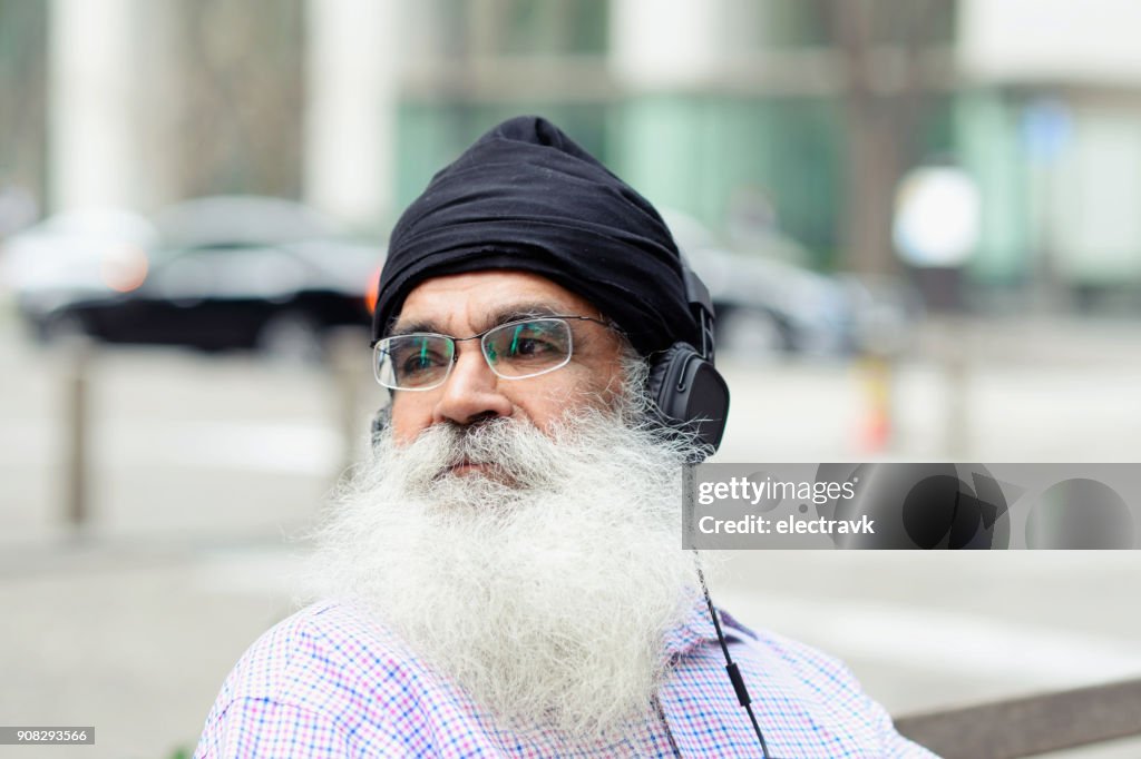 Older man listening to music
