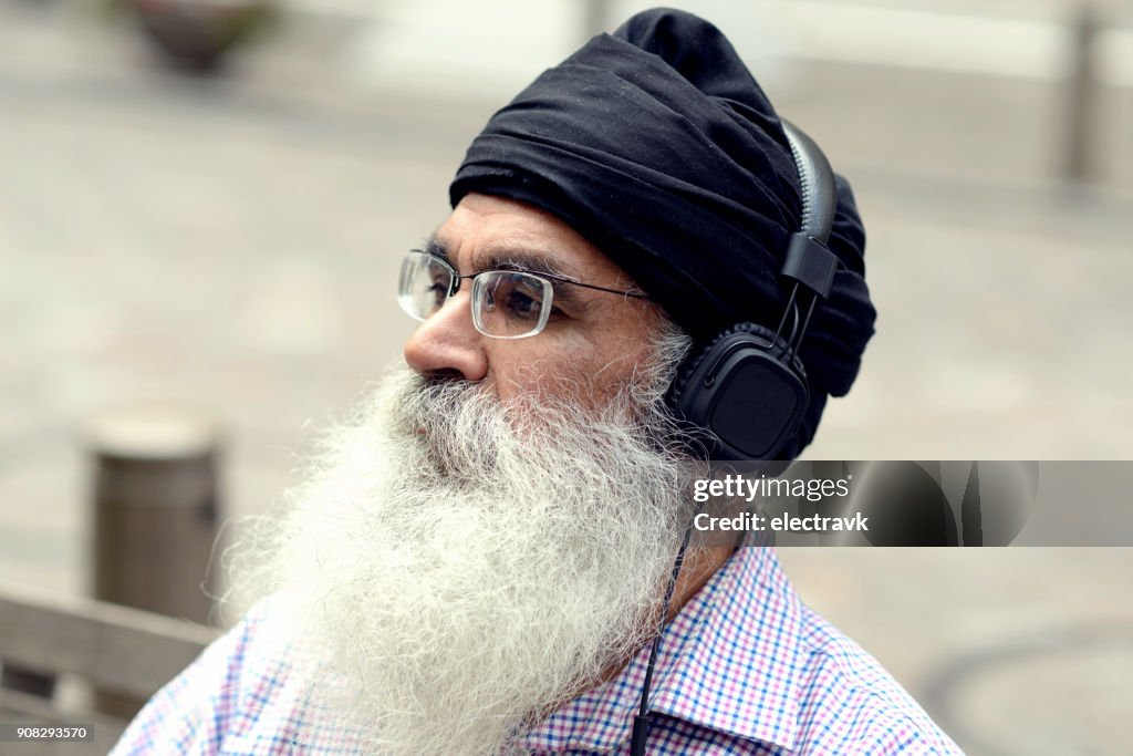 Older man listening to music