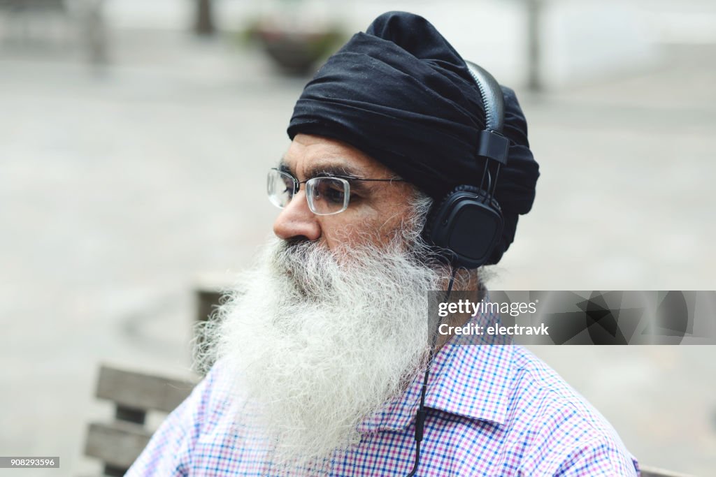 Older man listening to music