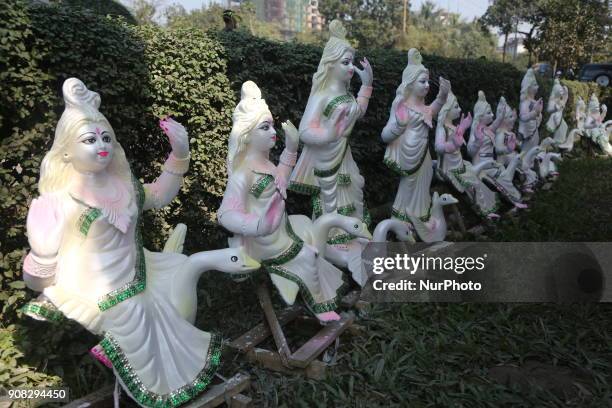 An artist giving his final touch to an idol of Devi Saraswati at Jagannath Hall of Dhaka University, Bangladesh, on 21 January 2018.