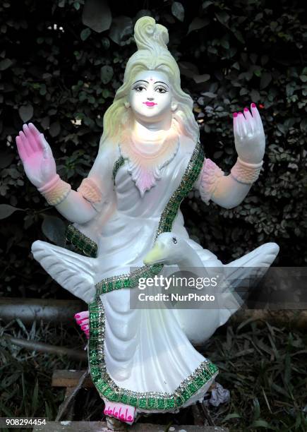 An artist giving his final touch to an idol of Devi Saraswati at Jagannath Hall of Dhaka University, Bangladesh, on 21 January 2018.