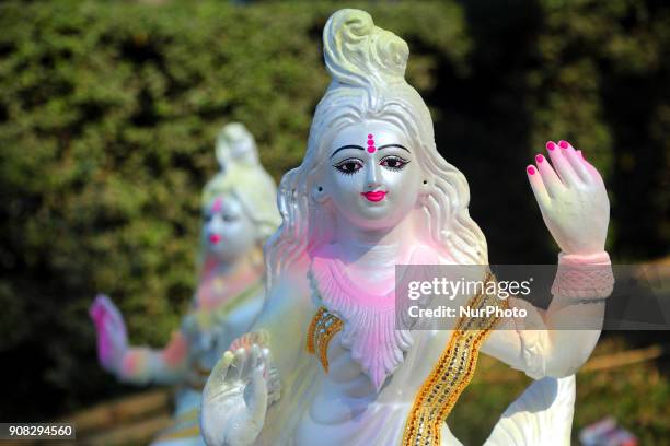 An artist giving his final touch to an idol of Devi Saraswati at Jagannath Hall of Dhaka University, Bangladesh, on 21 January 2018.