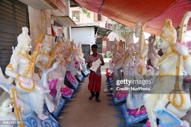 An artist giving his final touch to an idol of Devi Saraswati at Jagannath Hall of Dhaka University, Bangladesh, on 21 January 2018.