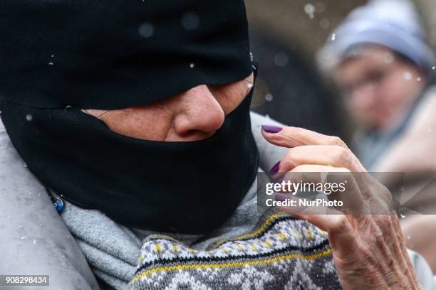 People wearing black bands on their eyes and mouth demonstrate in Stolen Justice silent protest at the Main Square in Krakow, Poland on 21 January,...