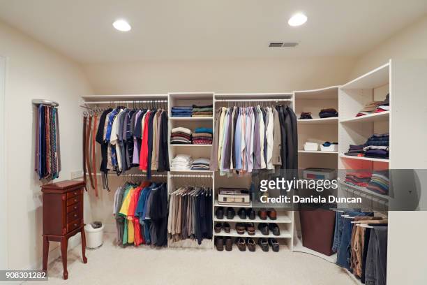 an organized man's closet - wardrobe stockfoto's en -beelden