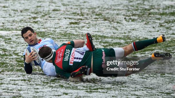 Racing player Brice Dulin is tackled by Nick Malouf of the Tigers during the European Rugby Champions Cup match between Leicester Tigers and Racing...