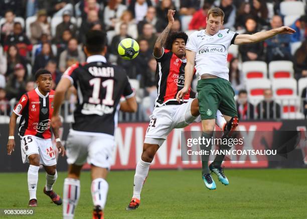 Nice's Brazilian defender Dante hits Saint-Etienne's Slovenian forward Robert Beric during the French L1 football match between Nice and Saint...