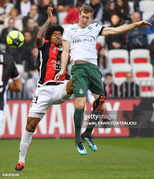 Nice's Brazilian defender Dante hits Saint-Etienne's Slovenian forward Robert Beric during the French L1 football match between Nice and Saint...