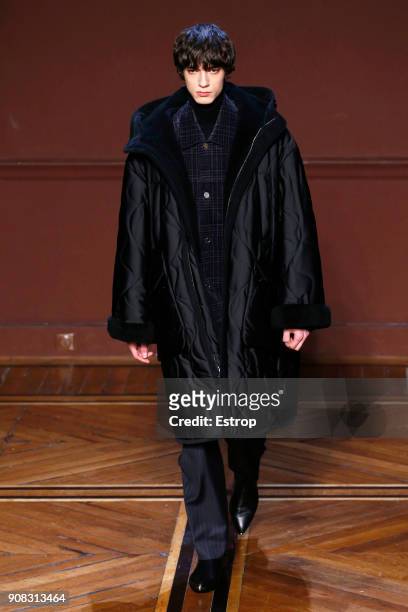 Model walks the runway during the Wooyoungmi : Menswear Fall/Winter 2018-2019 show as part of Paris Fashion Week on January 20, 2018 in Paris, France.