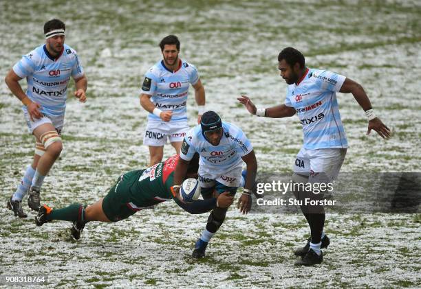 Racing prop Eddy Ben Arous breaks the tackle of Tigers hooker Tatafu Polota-Nau during the European Rugby Champions Cup match between Leicester...