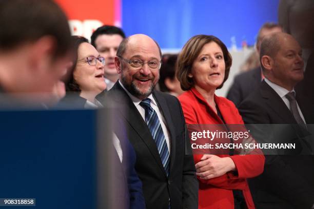 Martin Schulz , leader of Germany's social democratic SPD party, and leadership members stand together after delegates voted to begin formal...