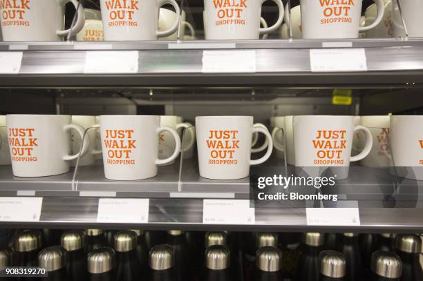 Mugs are displayed for sale at the Amazon Go store in Seattle, Washington, U.S., on Wednesday, Jan. 17, 2018. After more than a year of testing with...