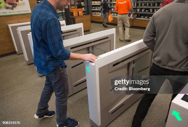 An Amazon.com Inc. Employee scans in to shop at the Amazon Go store in Seattle, Washington, U.S., on Wednesday, Jan. 17, 2018. After more than a year...