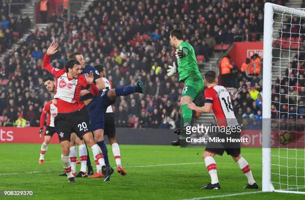 Harry Kane of Tottenham Hotspur scores their first goal past Alex McCarthy of Southampton during the Premier League match between Southampton and...
