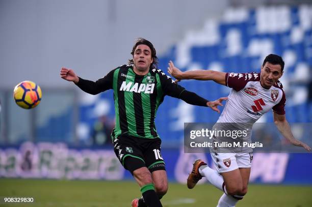 Alessandro Matri of Sassuolo and Nicolas Burdisso of Cremonese compete for the ball during the serie A match between US Sassuolo and Torino FC at...